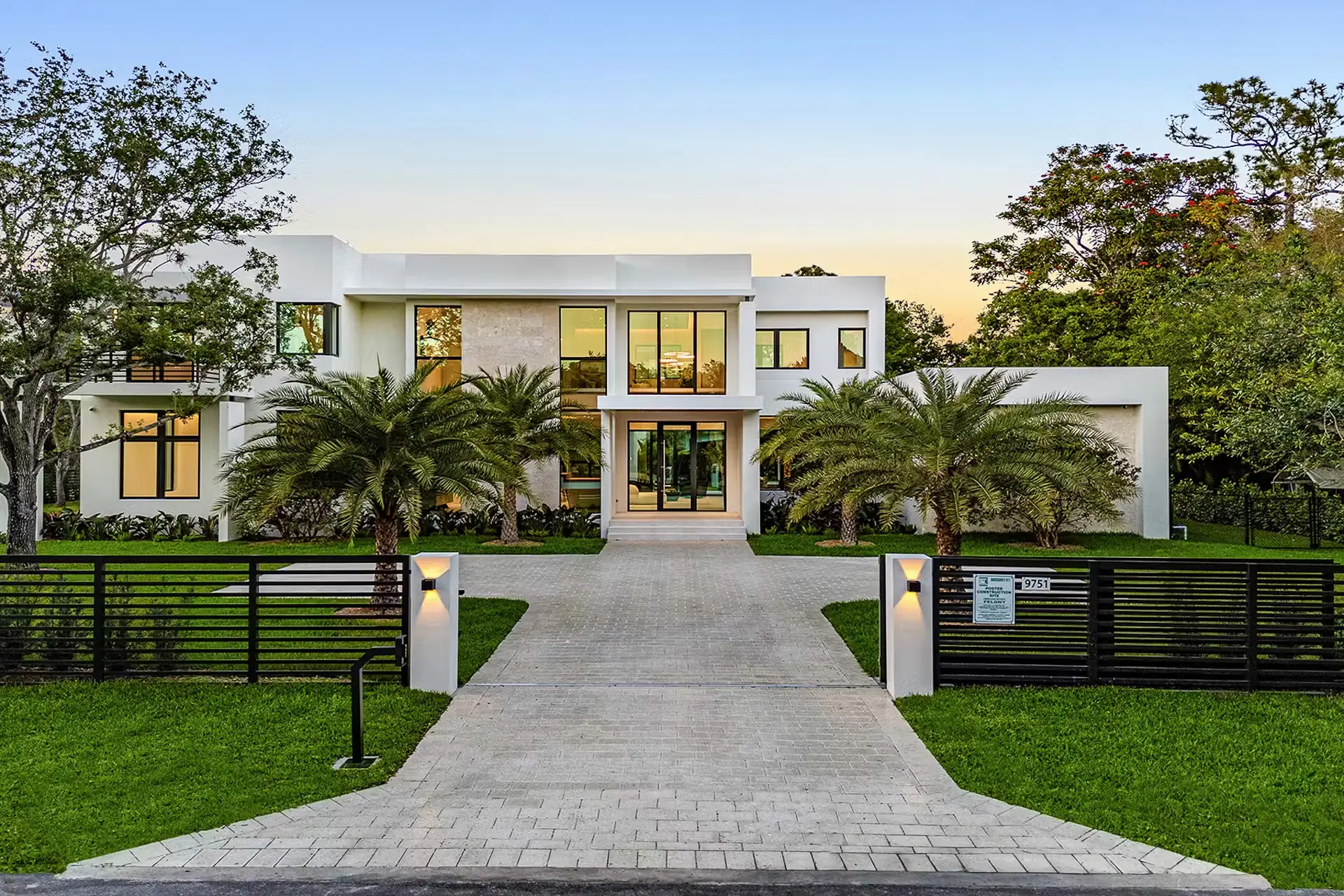 Tree-lined residential street with luxury homes in Pinecrest, Florida